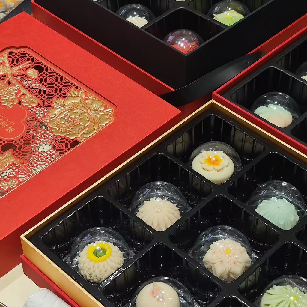 Custom rigid gift boxes with decorative printing and fitted inserts