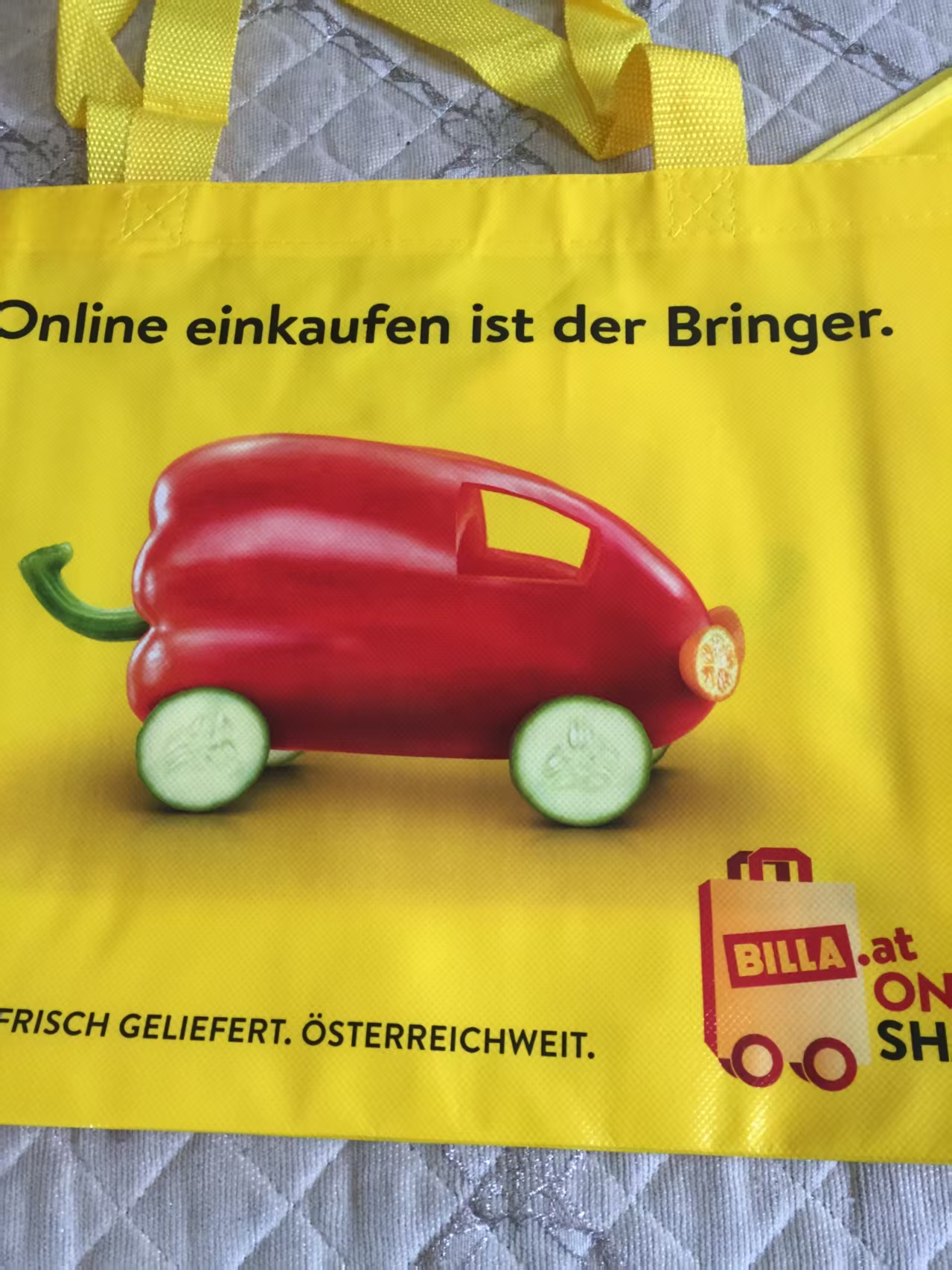 Close-up of photographic print on a yellow laminated non-woven bag